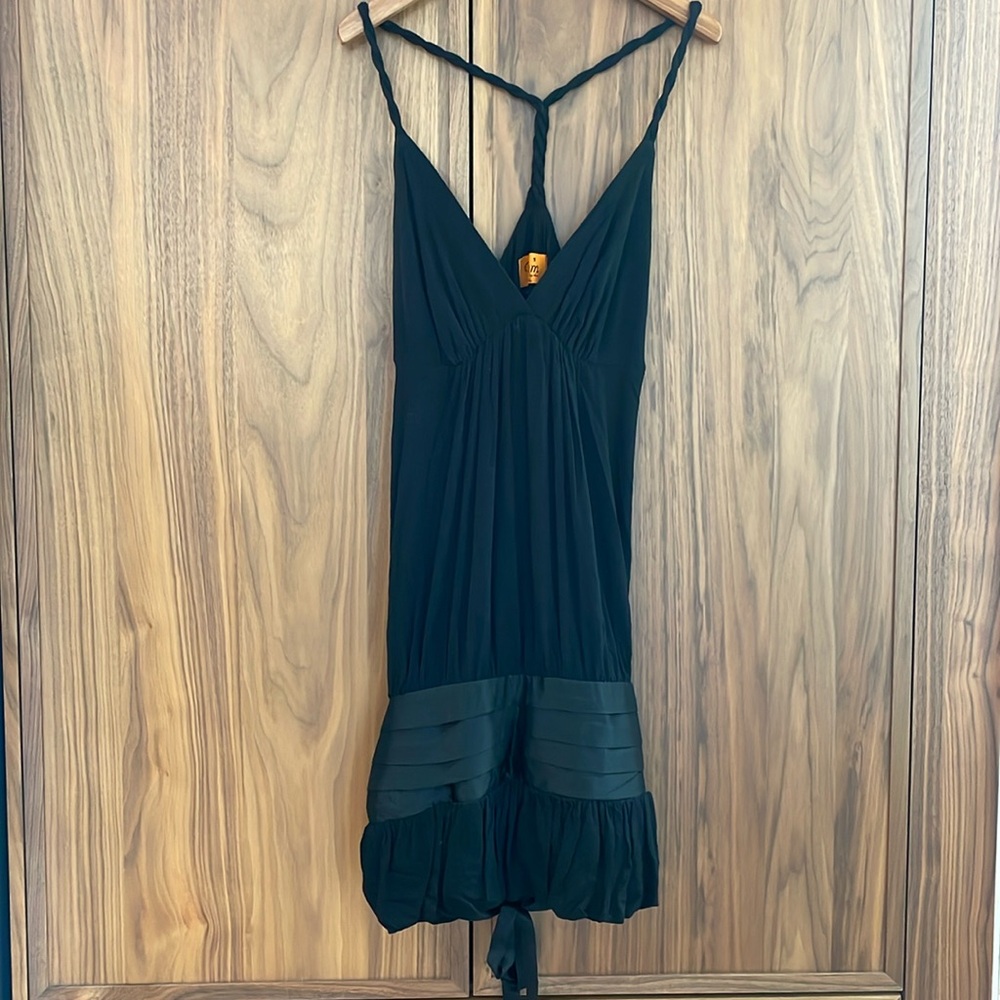 Black party dress with cute twist strap details and satin bubble hem.